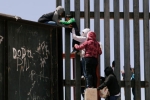 entering US via mexico, punjabis Crossing Border Fence, video clip shows punjabi women children crossing border fence into u s, Mexico border